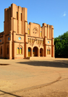 Ouagadougou, Burkina Faso: façade of the Catholic Cathedral of the Immaculate Conception of Ouagadougou - built in mudbrick, with two steeples of different heights, neo romanesque style - built by Monseigneur Joanny Thévenoud of the White Fathers - photo by M.Torres