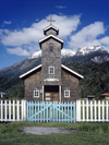 Aisén region, Chile: wooden church with white picket fence and blue gate on the camino austral – wooden shingles - Patagonia - photo by C.Lovell