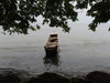 Gabon - Cap Estérias - Estuaire province: boat by the shore and the forest - photo by B.Cloutier