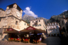Montenegro - Kotor: clock tower, café and castle - photo by D.Forman