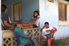 Three kids smile for the camera in Portobello, Colón, Panama, Central America - photo by H.Olarte