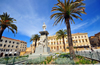 Sassari / Tàthari, Sassari province, Sardinia / Sardegna / Sardigna: Piazza d' Italia - palm trees and statue of Vittorio Emanuele II, symbol of the Italian Risorgimento - Palazzo della Provincia in the background - photo by M.Torres