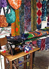 Lomé, Togo: SInger sewing machine and colorful fabrics - local fashion studio - photo by G.Frysinger